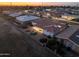 Aerial view of a house at sunset with a backyard patio at 4047 E Catalina Cir, Mesa, AZ 85206