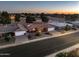 Property view at dusk, showing a single-story home in a residential area at 4047 E Catalina Cir, Mesa, AZ 85206