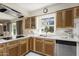 Updated kitchen with stainless steel appliances and wood cabinets at 4047 E Catalina Cir, Mesa, AZ 85206