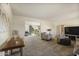 Living room with hardwood floors and view into dining area at 4047 E Catalina Cir, Mesa, AZ 85206