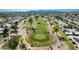 Stunning aerial view of the golf course, surrounded by homes in the community at 10214 E Michigan Ave, Sun Lakes, AZ 85248