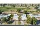 Aerial view of a home near the golf course with a tree-lined street at 10214 E Michigan Ave, Sun Lakes, AZ 85248