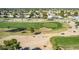 Aerial view of golf course with putting green at 10214 E Michigan Ave, Sun Lakes, AZ 85248