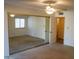 Bedroom with mirrored closet doors and ceiling fan at 11642 S Half Moon Dr, Phoenix, AZ 85044