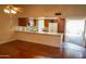 View of kitchen with a breakfast bar and ample cabinet space at 11642 S Half Moon Dr, Phoenix, AZ 85044