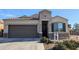 Single-story home with a two-car garage and well-manicured landscaping at 1703 N Hillcrest --, Mesa, AZ 85201