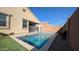 Inviting rectangular pool with artificial turf and rock landscaping at 1703 N Hillcrest --, Mesa, AZ 85201