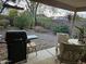 Backyard with gravel, plants, and a covered patio at 17475 W Caribbean Ln, Surprise, AZ 85388