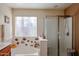 Clean bathroom with shower, tub, and whimsical decor at 17475 W Caribbean Ln, Surprise, AZ 85388