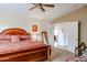 Large bedroom with a wooden bed frame and ample closet space at 17475 W Caribbean Ln, Surprise, AZ 85388