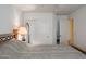 Bedroom with a double door closet and mirror at 17475 W Caribbean Ln, Surprise, AZ 85388