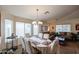 Bright dining area with a tiled floor and window seating at 17475 W Caribbean Ln, Surprise, AZ 85388
