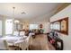 Dining room features a table set for four and a view to living room at 17475 W Caribbean Ln, Surprise, AZ 85388
