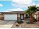 One-story house with a two-car garage and desert landscaping at 17475 W Caribbean Ln, Surprise, AZ 85388