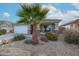 Charming one-story house with a well-maintained front yard at 17475 W Caribbean Ln, Surprise, AZ 85388
