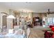 Kitchen features a breakfast bar and opens to a dining and living area at 17475 W Caribbean Ln, Surprise, AZ 85388