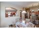 Bright kitchen features an island with seating and plenty of cabinet space at 17475 W Caribbean Ln, Surprise, AZ 85388