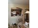 View of kitchen from dining area, showcasing breakfast bar and cabinetry at 17475 W Caribbean Ln, Surprise, AZ 85388