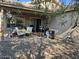 Covered patio with seating area and small grill at 17475 W Caribbean Ln, Surprise, AZ 85388
