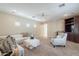 Comfortable living room featuring plush seating, a ceiling fan, and neutral decor, ideal for relaxation and entertaining at 4353 E Santa Fe Ct, Gilbert, AZ 85297