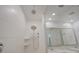 Walk-in shower with tiled walls and modern shower head at 4528 N 91St Dr, Phoenix, AZ 85037