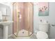 Modern bathroom with pink herringbone tile and gold fixtures at 602 E Taylor St, Tempe, AZ 85288
