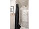 Shower with marble tile and black shower curtain at 602 E Taylor St, Tempe, AZ 85288