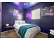 Bedroom with a full-size bed, neon accents, and a retro vibe at 602 E Taylor St, Tempe, AZ 85288