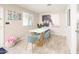 Charming dining area with a unique table and teal chairs at 602 E Taylor St, Tempe, AZ 85288
