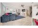 Bright and airy living room with a sectional sofa, geometric rug, and tile floors at 602 E Taylor St, Tempe, AZ 85288