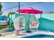 Enjoy the poolside seating with a pink umbrella at 602 E Taylor St, Tempe, AZ 85288