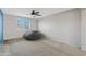 Bright bedroom with ceiling fan and window at 64 W Shannon St, Gilbert, AZ 85233