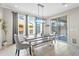 Bright dining area with wooden table, bench, and sliding door access to patio at 64 W Shannon St, Gilbert, AZ 85233