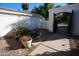 Landscaped side yard with a gate and pathway at 7214 E Royal Palm Rd, Scottsdale, AZ 85258