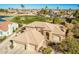 Two-story home with tile roof and a golf course view in a luxury community at 9048 E Cedar Waxwing Dr, Sun Lakes, AZ 85248