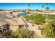 Landscaped backyard oasis with a water fountain and golf course views at 9048 E Cedar Waxwing Dr, Sun Lakes, AZ 85248