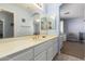 Bathroom with double vanity and mirrored medicine cabinet at 9048 E Cedar Waxwing Dr, Sun Lakes, AZ 85248