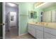Clean bathroom with double vanity, light walls and tile floors at 9048 E Cedar Waxwing Dr, Sun Lakes, AZ 85248