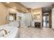 Spa-like bathroom with double sinks, a soaking tub and a walk-in shower at 9048 E Cedar Waxwing Dr, Sun Lakes, AZ 85248
