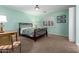 Charming bedroom with light walls, a double bed and a private balcony at 9048 E Cedar Waxwing Dr, Sun Lakes, AZ 85248