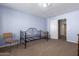Bedroom with daybed and built-in shelving at 9048 E Cedar Waxwing Dr, Sun Lakes, AZ 85248