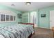 Serene bedroom with light walls, a double bed and built-in shelving at 9048 E Cedar Waxwing Dr, Sun Lakes, AZ 85248