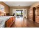 Bright bedroom with wood flooring, a wooden bed frame and access to a patio at 9048 E Cedar Waxwing Dr, Sun Lakes, AZ 85248