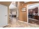 Elegant entryway with view to living room and home office at 9048 E Cedar Waxwing Dr, Sun Lakes, AZ 85248