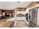 Eat-in kitchen with granite countertops and stainless steel appliances at 9048 E Cedar Waxwing Dr, Sun Lakes, AZ 85248