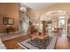 Bright and airy living room with hardwood floors, staircase, and high ceilings at 9048 E Cedar Waxwing Dr, Sun Lakes, AZ 85248
