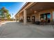 Covered patio with seating area and access to backyard at 9048 E Cedar Waxwing Dr, Sun Lakes, AZ 85248