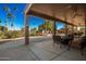 Covered patio with seating area and fountain view at 9048 E Cedar Waxwing Dr, Sun Lakes, AZ 85248