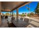 Large covered patio with dining area and golf course view at 9048 E Cedar Waxwing Dr, Sun Lakes, AZ 85248