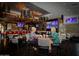 Upscale restaurant interior with comfortable seating and large screen TVs at 9048 E Cedar Waxwing Dr, Sun Lakes, AZ 85248